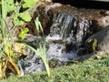 Brook, stones, grass in the park, Karhula, Finland