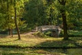 Summer landscape with white bridge and a lantern in the forest.. Gatchina, Russia. Royalty Free Stock Photo