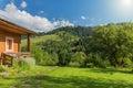 Summer landscape. Wooden house with a view of the Carpathian Mountains. Royalty Free Stock Photo