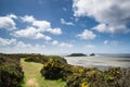 Summer landscape of Worm's Head and Rhosilli Bay in Wales