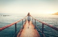 Summer landscape with young woman with backpack Royalty Free Stock Photo