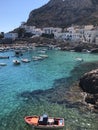 Summer landscapes from Levanzo, Sicily, Italy. Holidays in Sicily. Clear water, floating boats near the shore. Royalty Free Stock Photo