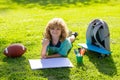 Summer leisure with children. Kid boy create artist paints, summer vacation. School child drawing in summer park Royalty Free Stock Photo
