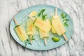 Summer lemonade popsicles with lime, mint leaves and chipped ice Royalty Free Stock Photo