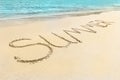 The Summer word written on the beach sand. Royalty Free Stock Photo