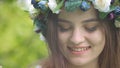 Summer lifestyle of beautiful woman holding in her hands bouquet of wild flowers.