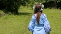 Summer lifestyle of beautiful woman holding in her hands bouquet of wild flowers.