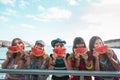 Summer lifestyle concept with group of trendy people cheerful happy women enjoying the outdoor leisure acitivty with red fresh Royalty Free Stock Photo