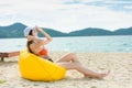 Summer lifestyle happy young girl with tanned sexy body. Tropical island beach. Wearing stylish bikini and sunglass Royalty Free Stock Photo