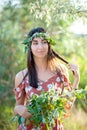 Summer lifestyle portrait of beautiful romantic girl holding bouquet of wild flowers Royalty Free Stock Photo