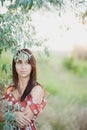 Summer lifestyle portrait of beautiful romantic girl holding bouquet of wild flowers Royalty Free Stock Photo