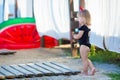 Summer lifestyle portrait of pretty girl swimming posing on the back on the inflatable watermelon in the ocean, wearing stylish Royalty Free Stock Photo