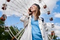 Summer lifestyle portrait woman enjoy nice day, talking smartphone. Happy female in front of ferris wheel. Young girl Royalty Free Stock Photo