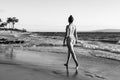 Summer lifestyle pretty young woman with tanned sexy body. Enjoying life in the clear sea water on the beach of the Royalty Free Stock Photo