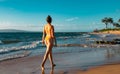 Summer lifestyle pretty young woman with tanned sexy body. Enjoying life in the clear sea water on the beach of the Royalty Free Stock Photo