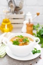 Summer light vegetarian vegetable soup with carrot, potato, cabbage and grean peas on white background. Diet healthy and tasty lun Royalty Free Stock Photo