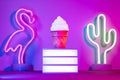 Summer with lightbox and flamingo,cactus and ice cream with neon pink and blue and green light on table with copy space.Trendy Royalty Free Stock Photo