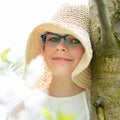 Summer little girl in straw hat outdoor portrait.