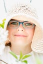 Summer little girl in straw hat outdoor portrait.