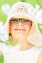 Summer little girl in straw hat outdoor portrait.