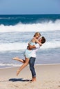 Summer lovin. a happy young couple enjoying a romantic day on the beach. Royalty Free Stock Photo