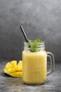 Summer mango and pineapple smoothie. Fresh fruit yellow smoothie