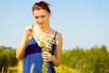 Summer meadow. woman with chamomiles