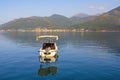 Summer Mediterranean landscape. Montenegro. View of Kotor Bay near Tivat city. Fishing boat on water