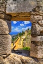 Summer mediterranean landscape - view from the loophole of the tower to the Klis Fortress near the city of Split Royalty Free Stock Photo