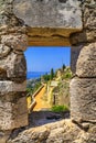 Summer mediterranean landscape - view from the loophole of the tower to the Klis Fortress near the city of Split Royalty Free Stock Photo