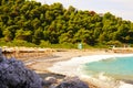 Sun umbrella and beds at Milia beach, Skopelos, Greece Royalty Free Stock Photo