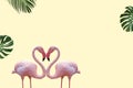 Summer minimal of couple flamingos and tropical leaves