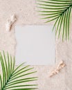 Summer minimalist card mockup / template on a sand background with palm leaves - ideal for elegant branding identities - flat lay