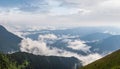 Summer misty and cloudy morning mountain tops with low clouds. Marmaros Carpathian, Ukraine Royalty Free Stock Photo