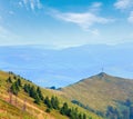 Summer misty mountain landscape with christian cross on top Ukraine, Carpathian Mountains Royalty Free Stock Photo