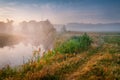 Summer misty sunrise on the river. Foggy river in the morning. S Royalty Free Stock Photo