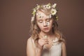 Summer mood. Art beauty portrait of gentle young woman with butterfly and flowers on brown background