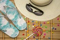 Summer mood - a hat, glasses, sweets, flip-flops