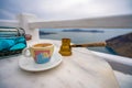 Summer morning, Enjoy Traditional Greek coffee at Greek Islands, Santorini, one of the most beautiful travel destinations of the Royalty Free Stock Photo