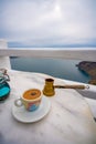 Summer morning, Enjoy Traditional Greek coffee at Greek Islands, Santorini, one of the most beautiful travel destinations of the Royalty Free Stock Photo