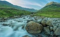 A summer morning by a flowing river and stone bridge in the heart of the Lake District Royalty Free Stock Photo