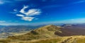 Summer mountain landscape aerial top view scenic photography highland ridge colorful day time and vivid blue sky white clouds Royalty Free Stock Photo