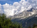 Summer mountain landscape. Alps. There are clouds on the mountain peaks. Royalty Free Stock Photo