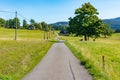 Summer mountain landscape with blue sky, Road through a meadow - Moravian-Silesian Beskydy, Grun, Czechia