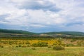 Summer mountain landscape. A village and a road against the background of mountains in the Cis-Baikal basin. Irkutsk region, Royalty Free Stock Photo