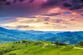 Summer mountain rural landscape, awesome evening sunset view on village and meadow Royalty Free Stock Photo