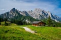 Summer mountain scenery with alpine meadow and traditional wooden hut, Salzburg, Austria Royalty Free Stock Photo