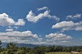 Summer mountains green grass and blue sky with clouds. Royalty Free Stock Photo