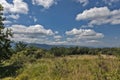 Summer mountains green grass and blue sky with clouds. Royalty Free Stock Photo