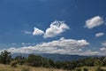 Summer mountains green grass and blue sky with clouds. Royalty Free Stock Photo